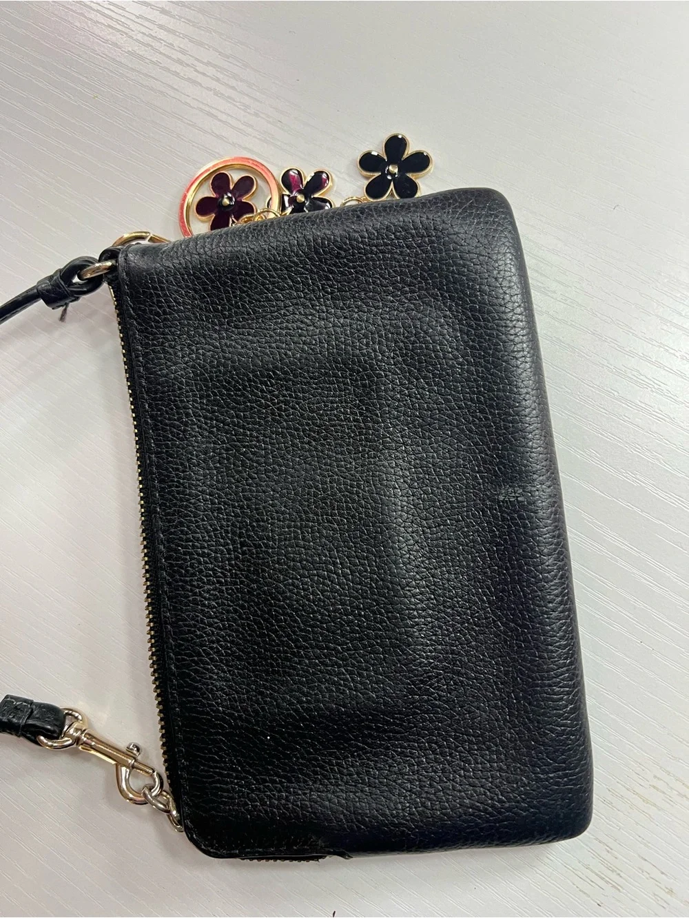Coach Black Pebbled Leather Wristlet with Gold Floral Charm